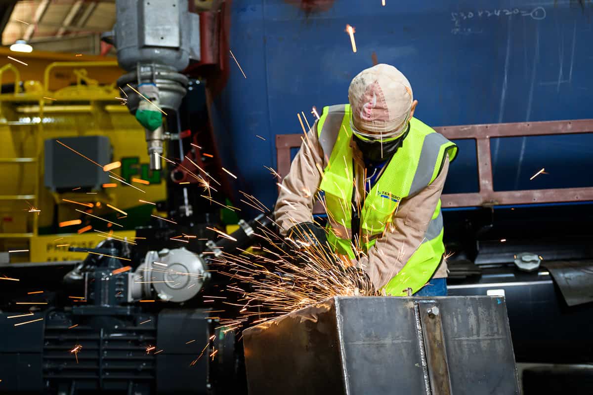 commercial photography Singapore - photographer capturing shots of mechanic working with grinder