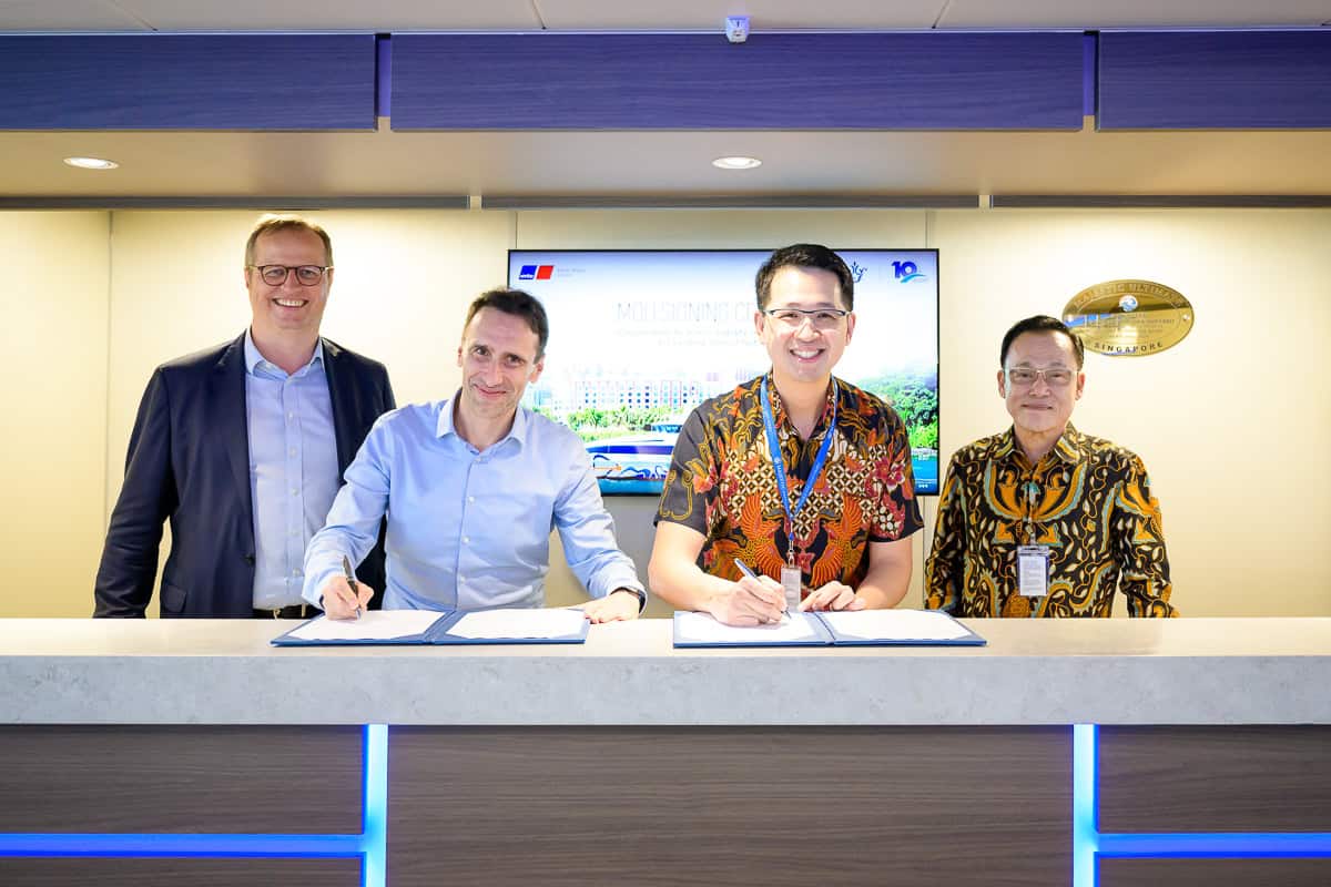 Event photography Singapore - photographer capturing shots of contract signing event