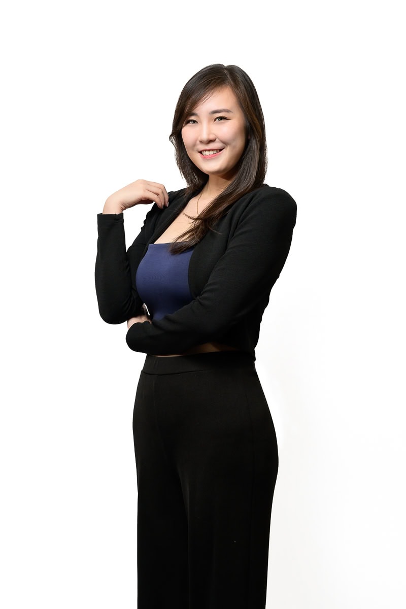Business headshot of financial consultant photographed for corporate profile Singapore