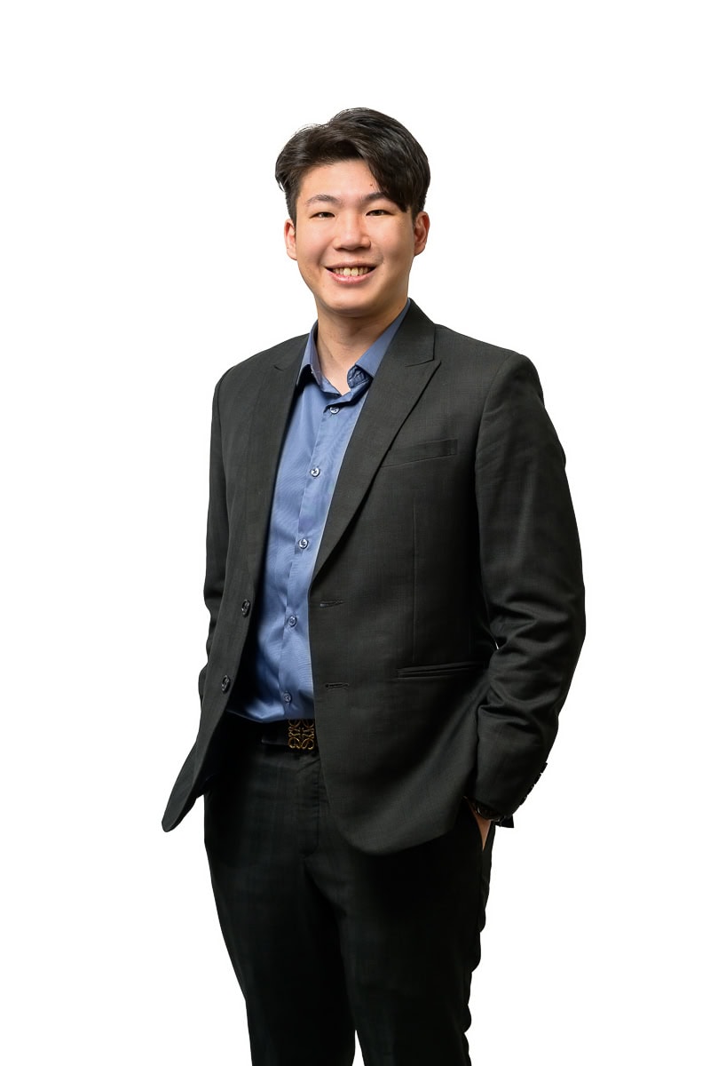 Corporate headshot of financial consultant in business attire Singapore