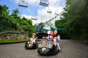 Mother and children riding Skyline Luge in Sentosa for commercial marketing campaign