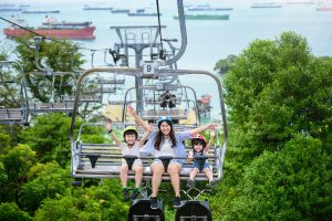 Mother and kids enjoying luge ride during Skyline Luge Singapore photoshoot