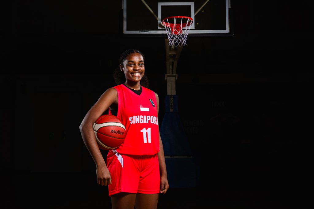 athlete basketball portrait with controlled lighting and dark background
