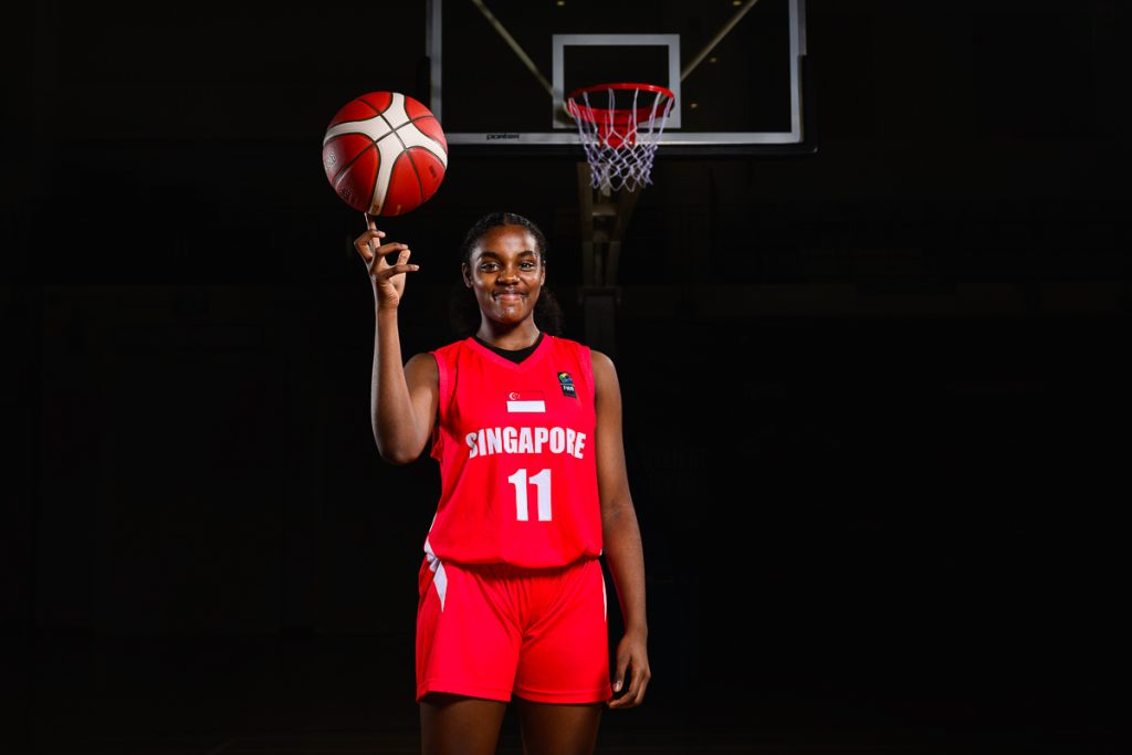 basketball player portrait in dark studio lighting setup