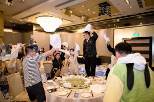 Candid moments during a corporate D&D event — capturing genuine reactions and interactions between guests.