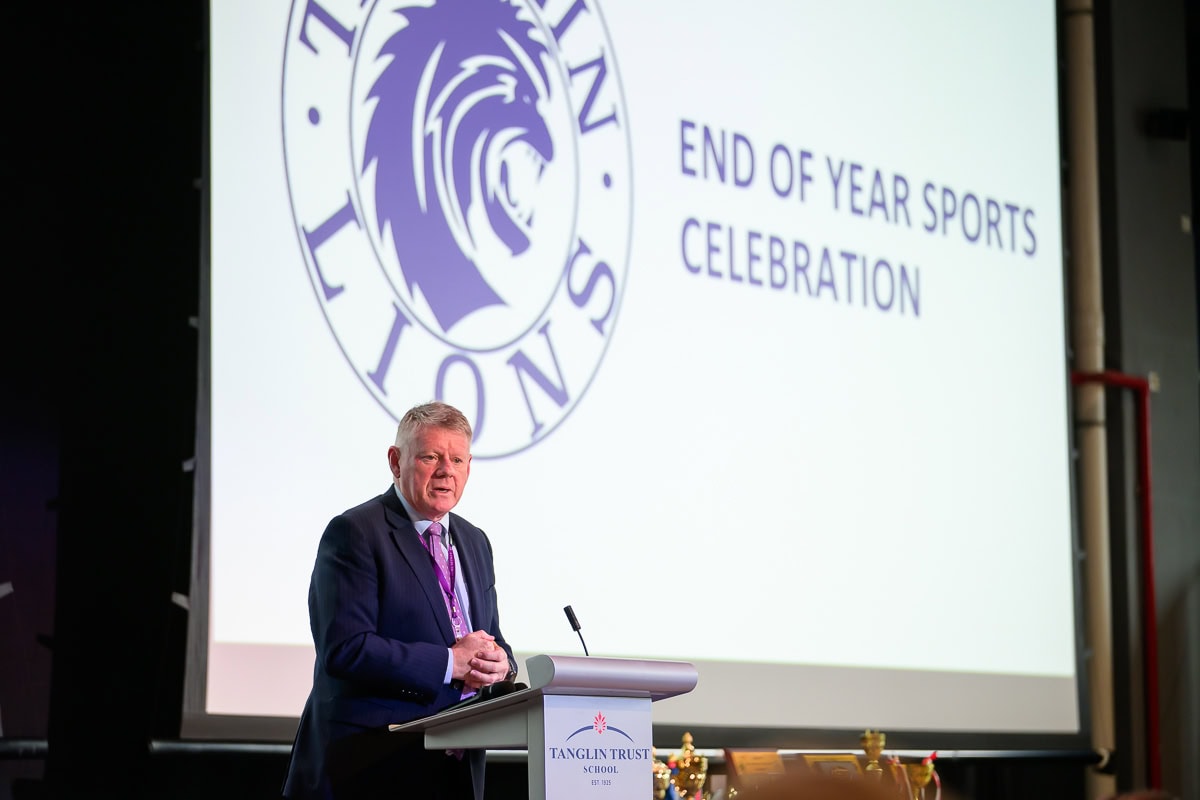 Speaker addressing audience at Tanglin Trust School sports awards ceremony