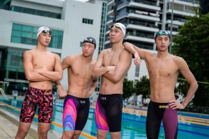 Competitive swimmer posing in swimwear during a commercial sports photography session in Singapore.