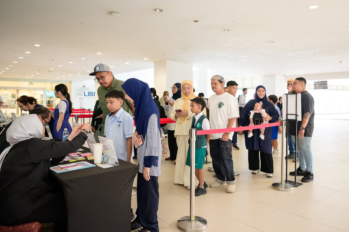 Guests registering at the scholarship award ceremony before the event begins in Singapore.