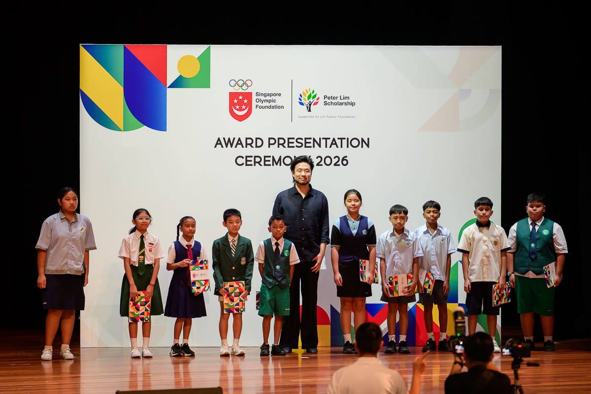 Scholarship recipient receiving an award during the ceremony in Singapore.