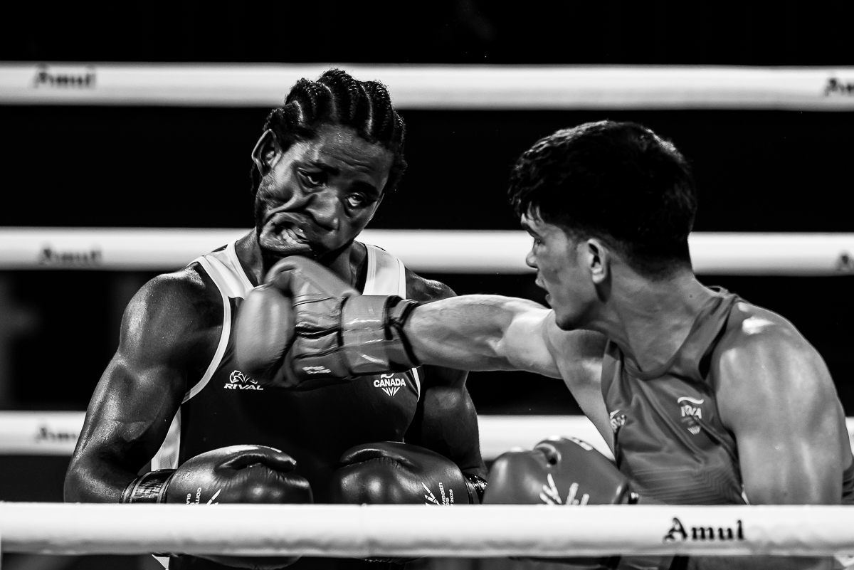 Boxing sports photography capturing a punch connecting during the Glasgow 2026 Commonwealth Games