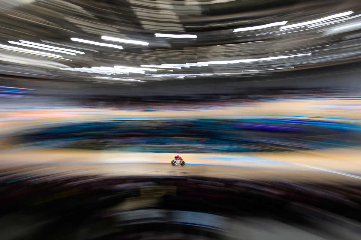 Track cycling sports photography using a wide-angle panning technique at the Glasgow 2026 Commonwealth Games