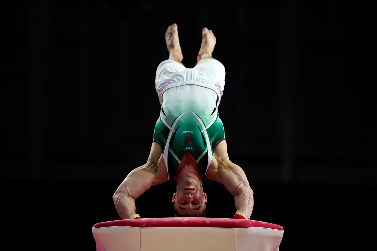 Gymnastics sports photography of an athlete launching from the vault at the Glasgow 2026 Commonwealth Games