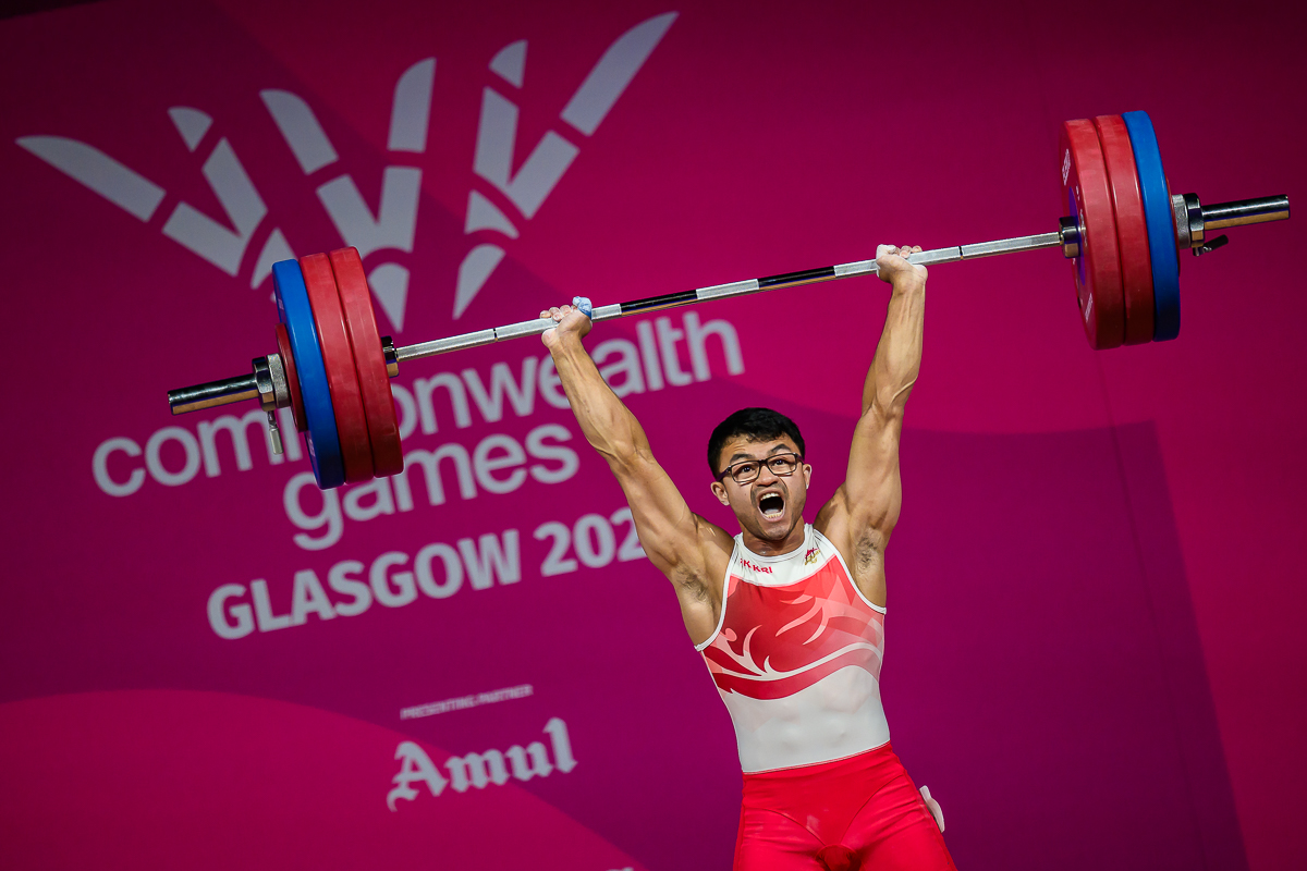 Weightlifter showing an intense expression during competition at the Glasgow 2026 Commonwealth Games